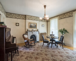 17 Madison Street Front Parlor–In this room Susan B. Anthony was arrested by a U.S. Marshall for voting in the 1872 election. She hoped to prove that women had the legal right to vote under the provisions of the recently passed 14th and 15th amendments to the Constitution. At her trial, a hostile federal judge found her guilty and fined her $100, which she refused to pay. 17 Madison Street Front Parlor